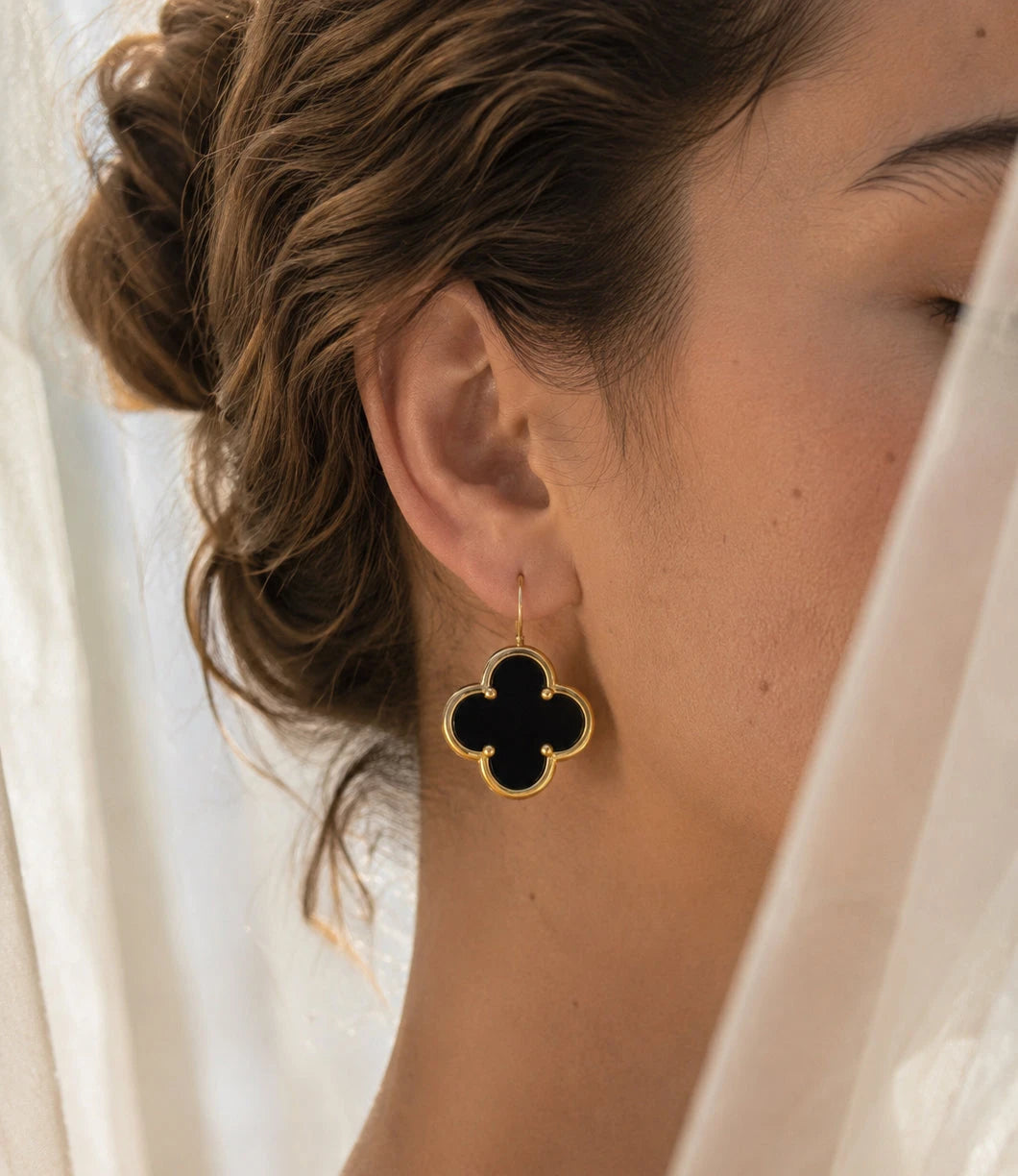 Pair of gold-plated four-leaf clover earrings with black onyx