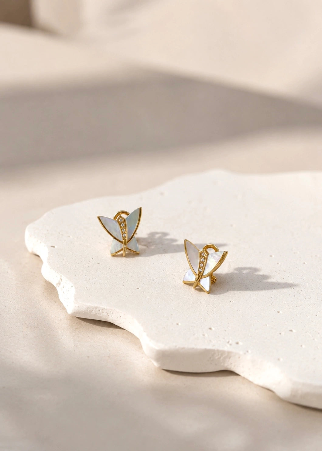 Butterfly earrings with natural white mother of pearl and four white zircons