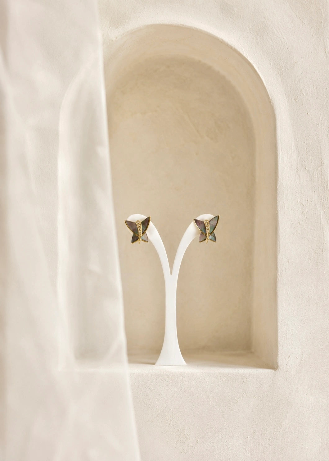 Gold-plated butterfly earrings with natural mother of pearl tones