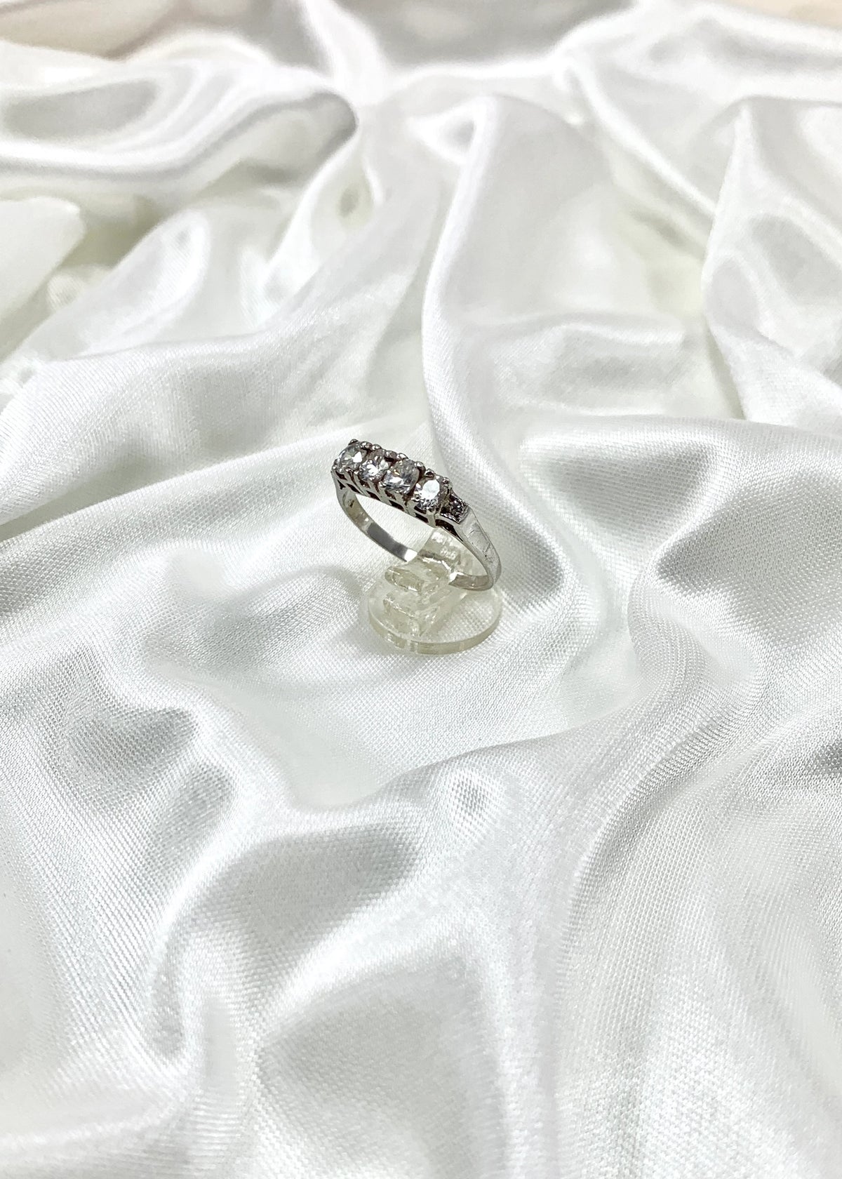 Sterling silver band ring with white zircons, close-up view