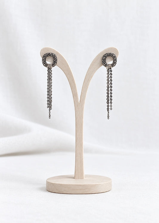 Marcasite drop earrings in oxidized sterling silver 925 on a stand